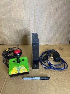 lot 43 image: Lot Of 2 - Electronic Items (Frogger Plug N Play & NetGear)- In Condition As Shown (READ)