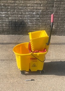 lot 238 image: Large Commercial Rubbermaid Rolling Wheels 31 Qt Mop Bucket 91-9C70-B1 Yellow - In Condition As Shown