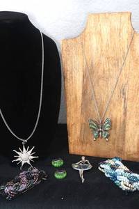 lot 26 image: Abalone Shell Butterfly Necklace, Abalone Brooch, Crystal Sun Necklace, Millefiori Earrings and Two Stretch Bracelets
