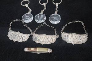 lot 33 image: Three Steiff Pewter Liquor Tags, Three LED Crystal Key Chains, and Vintage Pocket Knife
