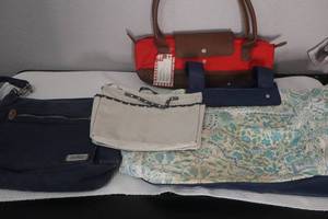 lot 57 image: New wine tote, JoAnn Tote Bag (used), Travelon Handbag (used) with wear