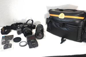 lot 74 image: Vintage Minolta 7000 Camera with Extra Lenses and Case