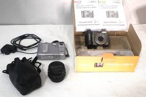 lot 75 image: Canon Powershot, Fuji Camera and Pentax Lense