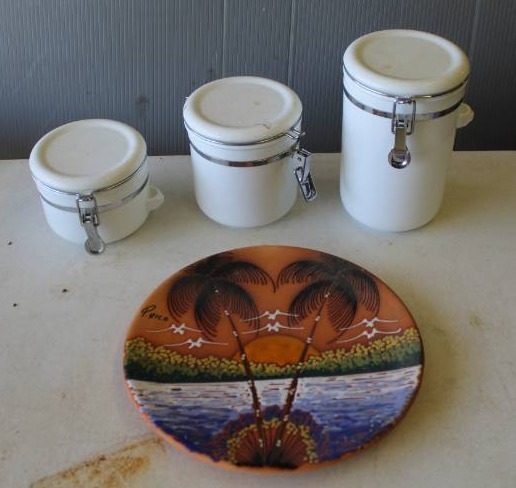 lot 10 image: plate featuring a hand-painted tropical beach scene and canister set