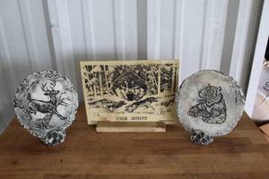lot 55 image: vintage Shapes of Clay wall plaque featuring a mother tiger and cub and vintage deer stag plaque and 1991 Montana Marble Inc. etched marble plaque featuring the artwork titled The Hunt by artist Bernie Brown.