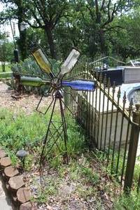 lot 96 image: decorative metal garden wind spinner, often referred to as a windmill or weathervane