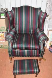 lot 124 image: traditional wingback armchair with an ottoman featuring striped upholstery