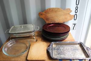 lot 128 image: metallic red charger plates and wooden cutting board shaped like a pig.and English silver-plated tray warmers and servers.and more see pictures for details