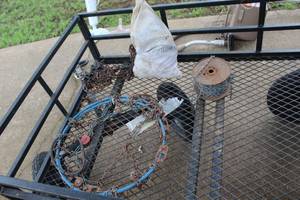 lot 134 image: tire chains and a bag full of chains and a roll of chain(wagon not included)