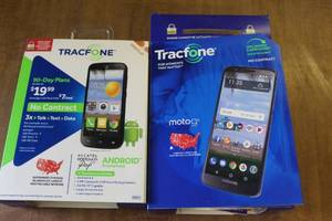 lot 16 image: two tracfone  they  both hold a charge