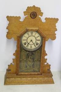 lot 51 image: This is an antique E. Ingraham gingerbread or parlor mantle clock, likely the Dahlia or a similar model from the late 19th century