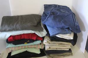 lot 142 image: Bag full of clothes ranging in sizes XL to XXL bottoms around size 42 to 44