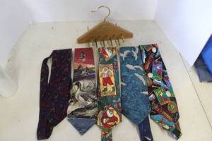 lot 149 image: vintage Woodlore aromatic cedar tie and belt or neckties organizer featuring brass-toned metal hooks with a hand full of neckties