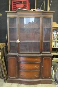 lot 161 image: vintage mahogany breakfront china cabinet featuring a two-piece design with glass display doors and a bowed-front lower buffet.