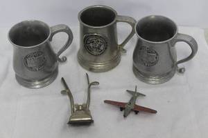 lot 170 image: vintage pewter mugs and vintage manual hair clippers & Tootsietoy Lockheed P-80 Shooting Star diecast airplane.