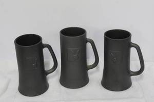 lot 171 image: vintage Playboy Club black glass beer mugs with embossed bunny logos