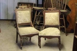 lot 218 image: These antique Victorian Eastlake chairs feature carved wooden frames and light yellow patterned upholstery see pictures one has some damage