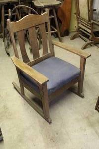 lot 220 image: rocking chair features straight vertical slats