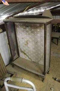 lot 303 image: antique glass display case has wooden framing