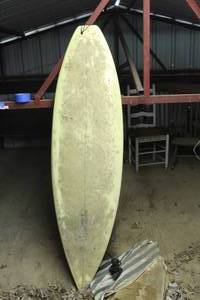 surfboard features a logo for Rachul Glassing