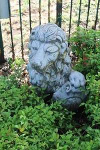 lot 320 image: stone garden statue of a lion holding a shield