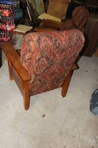 Mission-style reclining lounge chair features a patterned fabric upholstery and sturdy oak wood arms