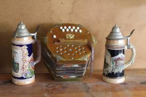 lot 340 image: vintage Olympic beer stein and Vintage German Concertina musical instrument