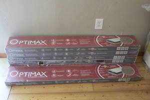 lot 409 image: 6-sealed boxes of OptiMax Performance Hybrid Resilient Flooring (the bid is X6)