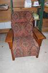 Mission-style reclining lounge chair features a patterned fabric upholstery and sturdy oak wood arms