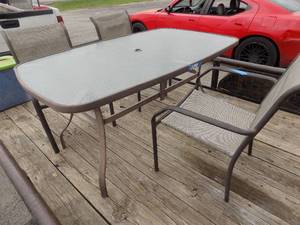 lot 18 image: Glazed top oblong patio table with 3 chairs