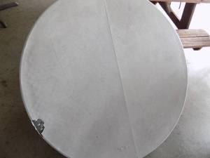 lot 62 image: 6 foot round table with legs  has a hole in the top