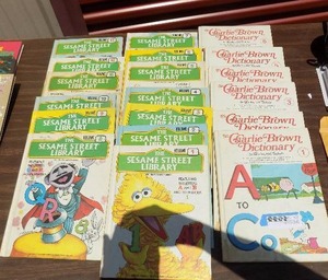 lot 136 image: Sesame street library books 1-13 Charlie Brown Dictionary 1- A-S