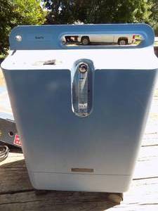 lot 207 image: Respironics OXYGEN  concentrator