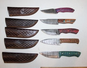lot 14 image: Damascus steel NEW knives (5 times the money)