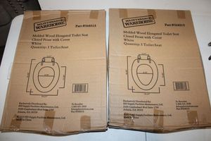 lot 17 image: Two toilet seats elongated wood (still in box)