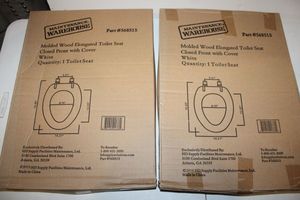 lot 18 image: Two toilet seats elongated wood (still in box)