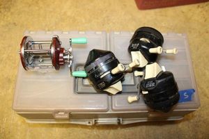 lot 73 image: Fishing reels and tackle box