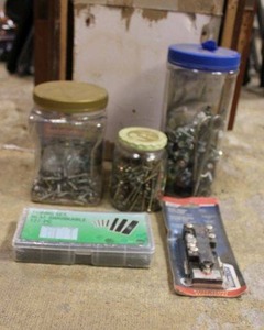 lot 125 image: Hardware and screws, heat shrink tubes, and water heater thermostat