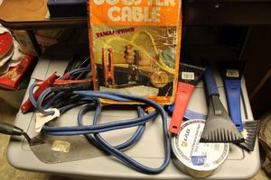 lot 143 image: Tools Jumper cables, brick trowel, duct tape, and ice scrapers