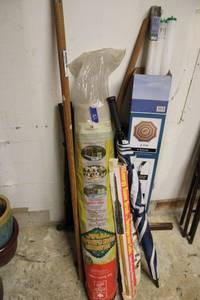 lot 163 image: Roll of sun screen fabric, frig coil brush, umbrella, and fluorescent light bulbs