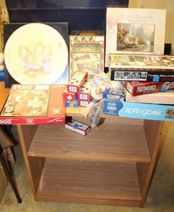 lot 172 image: Puzzles and poker chips with small bookshelf