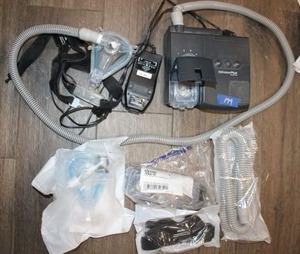 lot 179 image: Respironics C-pap machine with unopened parts as shown