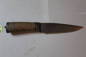lot 23 image: fixed-blade knife features a distinctive patterned blade commonly referred to as Damascus steel