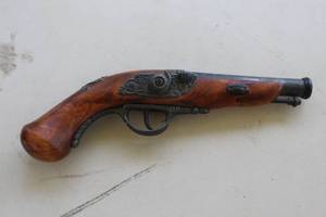 lot 63 image: This is a decorative, non-firing replica of an 18th-century English or French flintlock pistol
