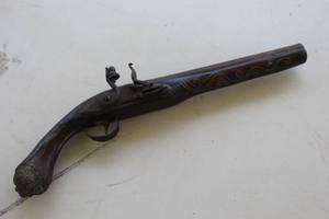 lot 64 image: This is a decorative, non-firing replica antique flintlock pistol