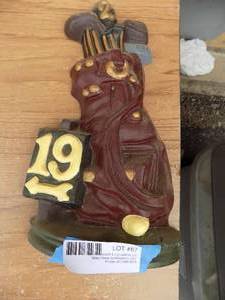 lot 67 image: Hole 19 cast iron door stop