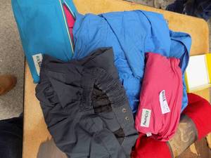 lot 99 image: Rain jackets and fleece blanket