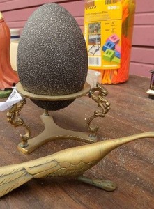 lot 131 image: Emu egg on brass holder and brass road runner