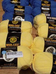 lot 202 image: Wool ease, lamb wool, and acrylic yarn pale yellow x7 blue x 7