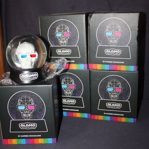 lot 36 image: Alamo Drafthouse 3D Skull Snow Globes